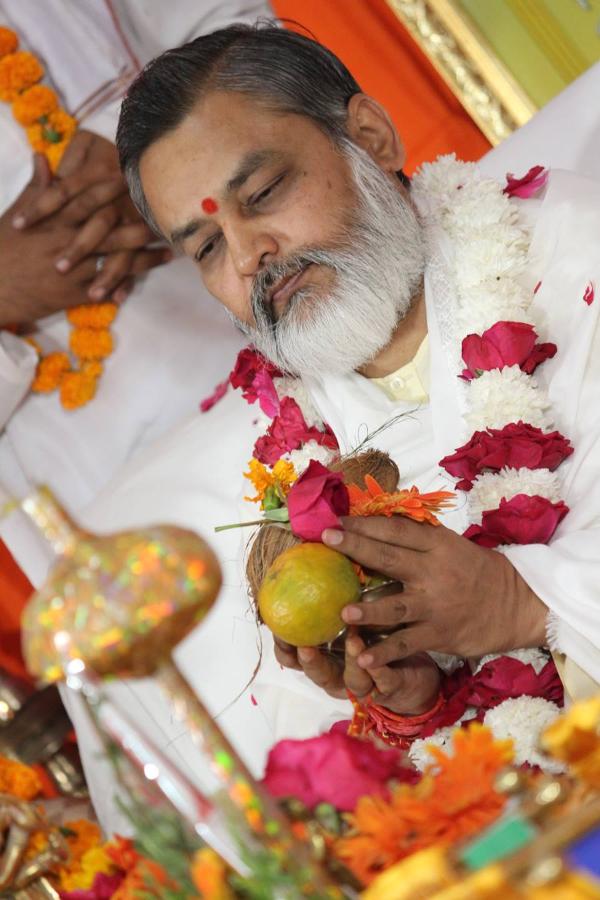 Girish ji receiving prasad.